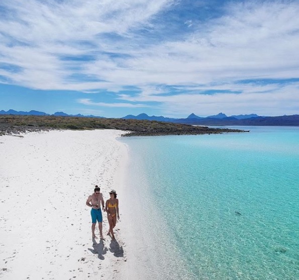 Couple Walking On Coronado Island Beach Loreto Couple Walking On Coronado Island Beach Loreto